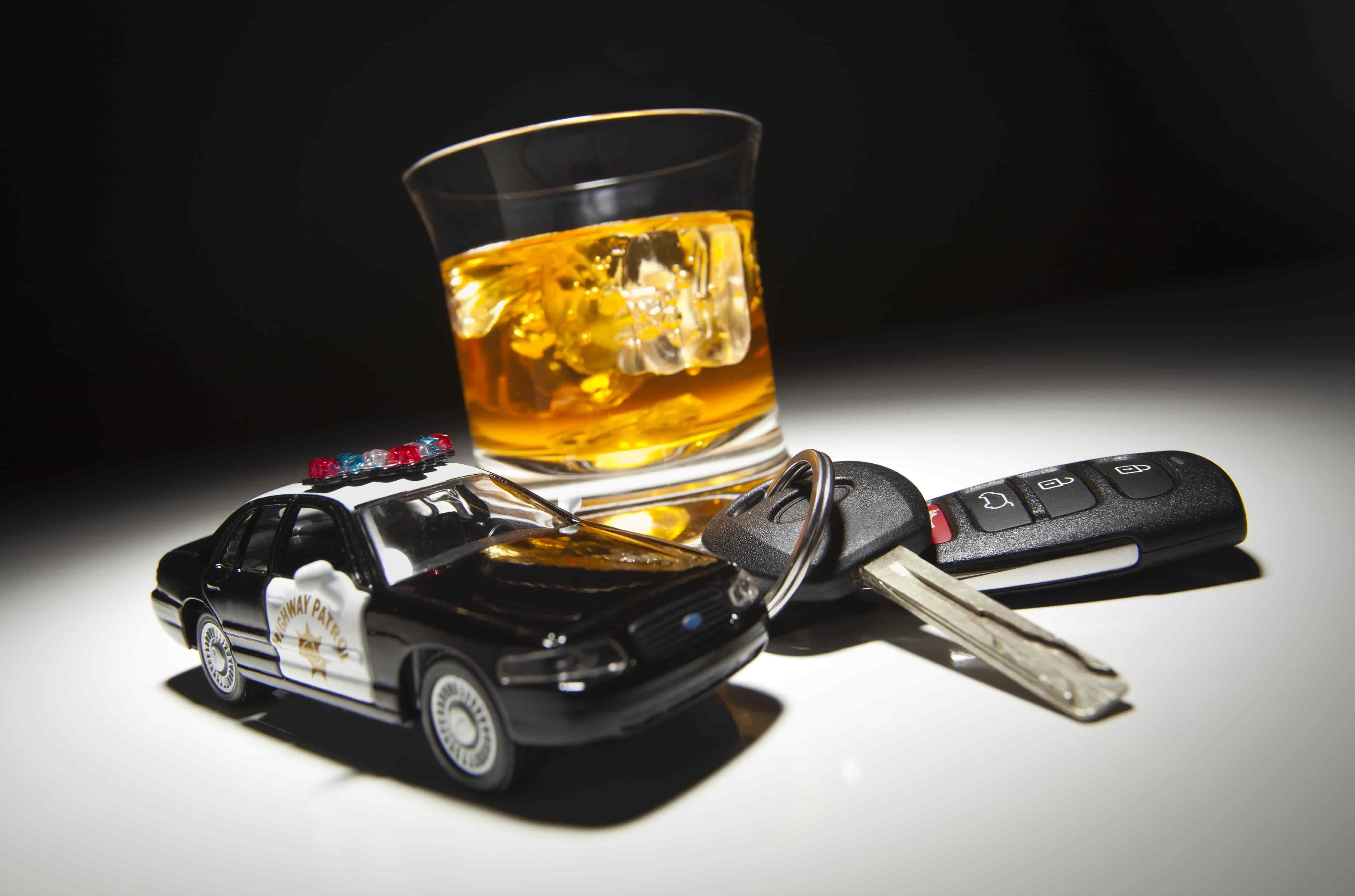 DUI car keys liquor police car